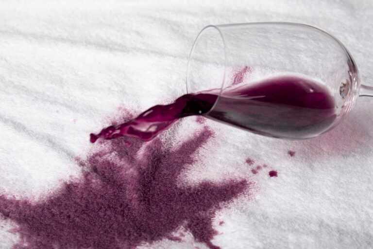 Wine spilled on rental linen.