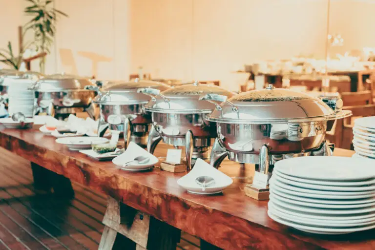Catering Table with Food Chafers and Plates